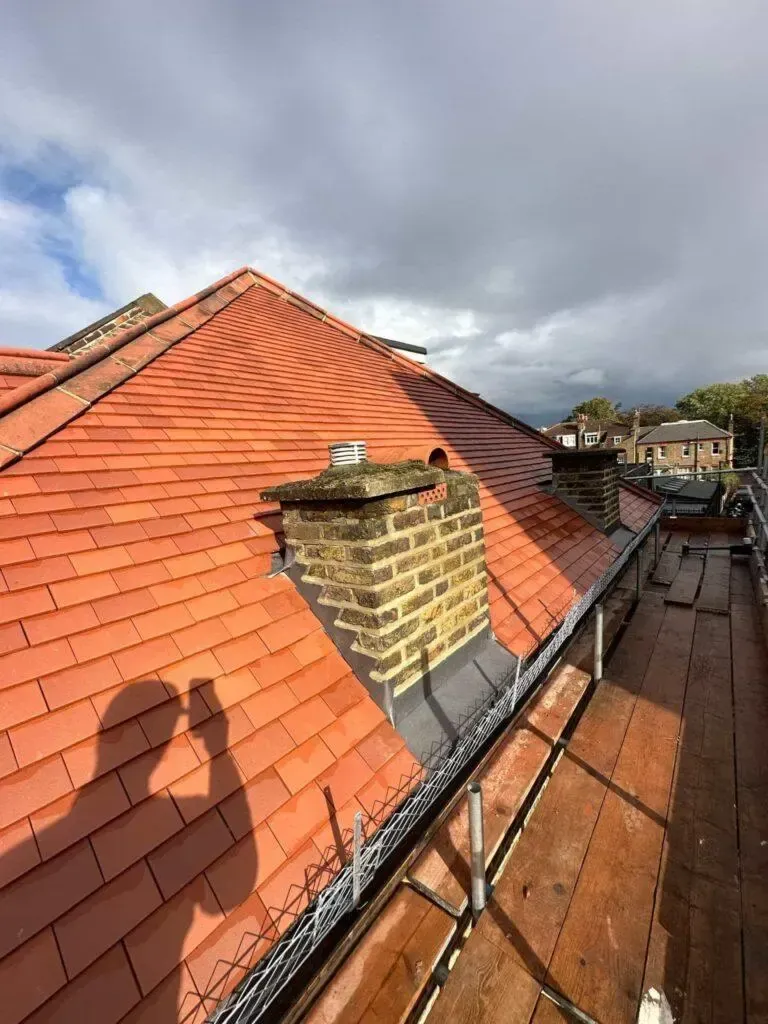 Clay tile roof renewed as part of our roofing services in Brentford